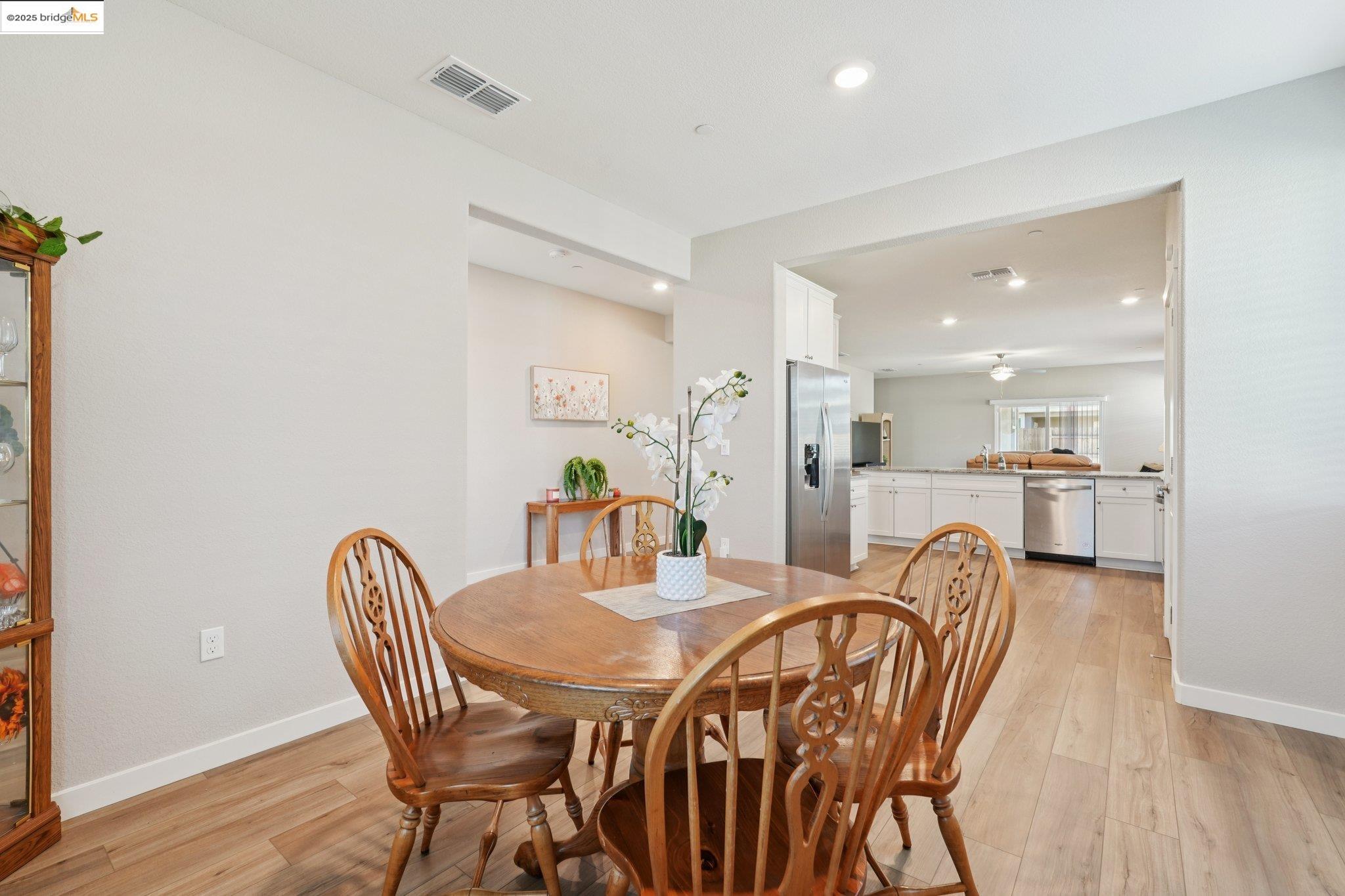 2119 Revival Lane Rio Vista, CA 94571 - Photo 14 of 44 a view of a dining room with furniture and wooden floor