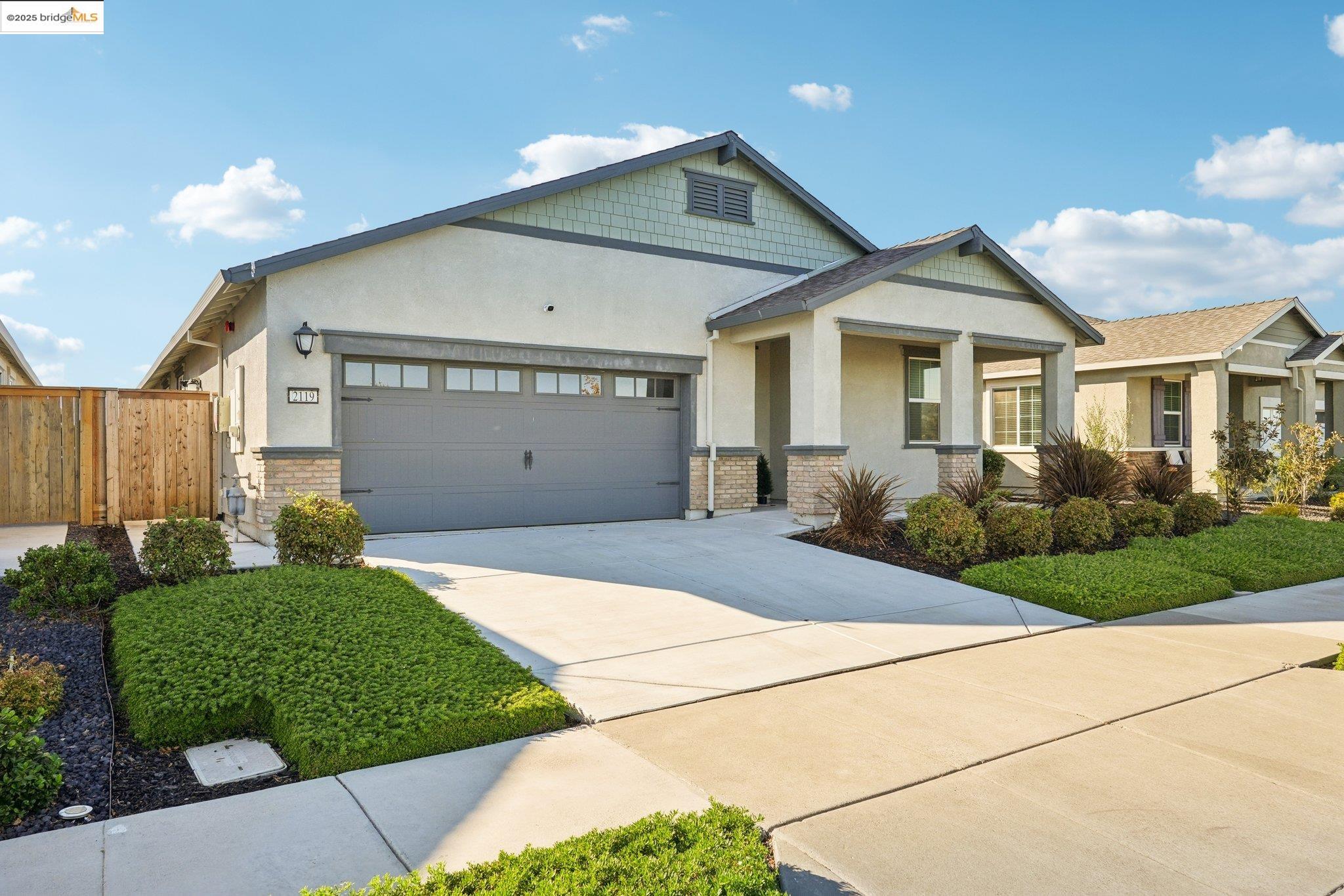 2119 Revival Lane Rio Vista, CA 94571 - Photo 3 of 44 a front view of a house with a yard and garage