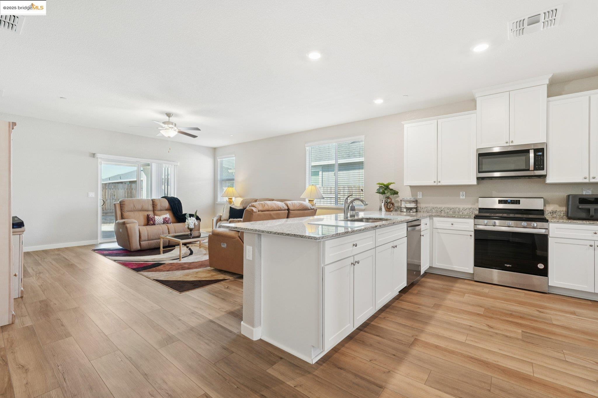 2119 Revival Lane Rio Vista, CA 94571 - Photo 4 of 44 a kitchen with sink cabinets and stainless steel appliances