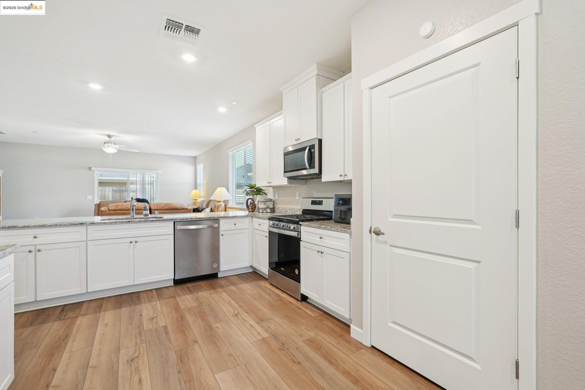 2119 Revival Lane Rio Vista, CA 94571 - Photo 10 of 44 a kitchen with white cabinets and white appliances
