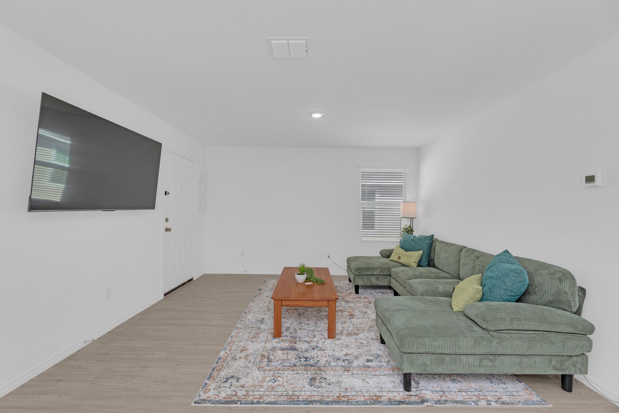 353 Marty Allen Loop Jarrell, TX 76537 - Photo 12 of 34 a living room with furniture and a flat screen tv