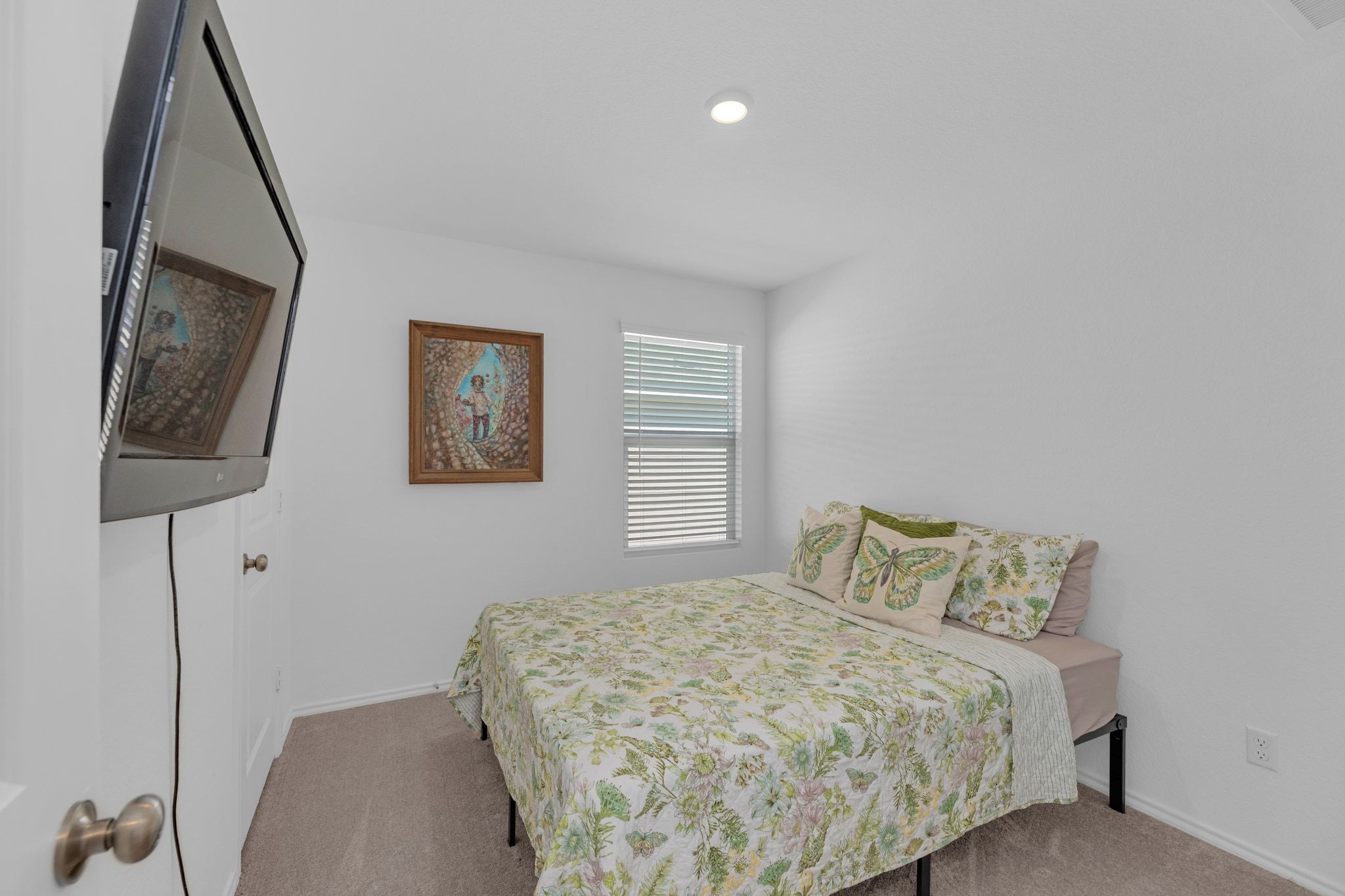 353 Marty Allen Loop Jarrell, TX 76537 - Photo 18 of 34 a bedroom with a bed and a lamp on table