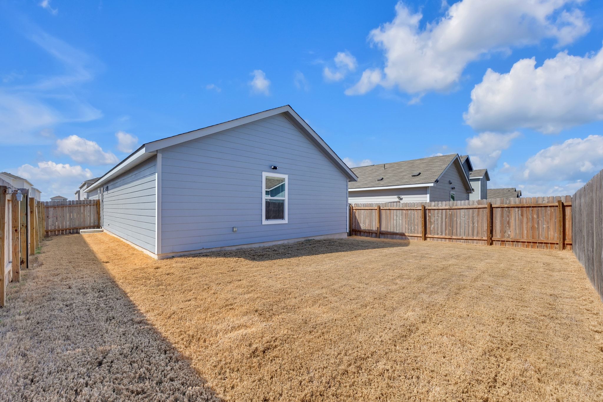 353 Marty Allen Loop Jarrell, TX 76537 - Photo 25 of 34 a view of a house with a yard