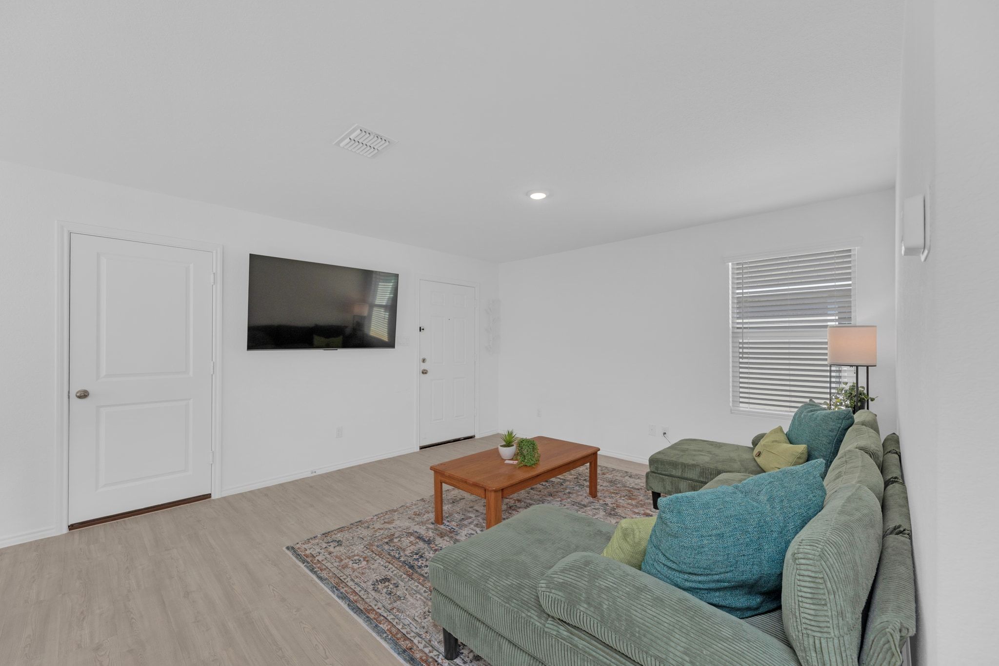 353 Marty Allen Loop Jarrell, TX 76537 - Photo 5 of 34 a living room with furniture and a flat screen tv