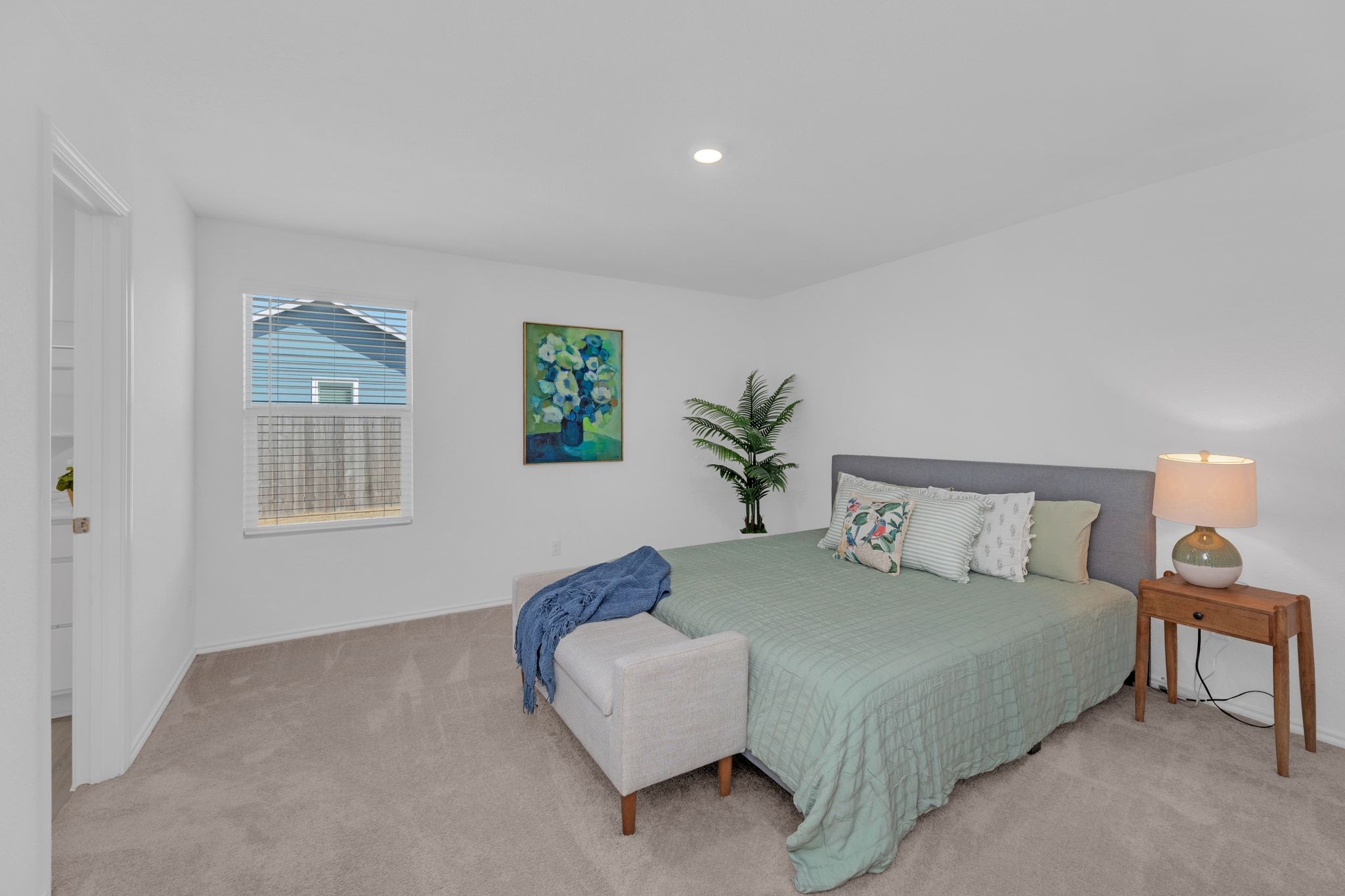 353 Marty Allen Loop Jarrell, TX 76537 - Photo 8 of 34 a spacious bedroom with a bed and a couch