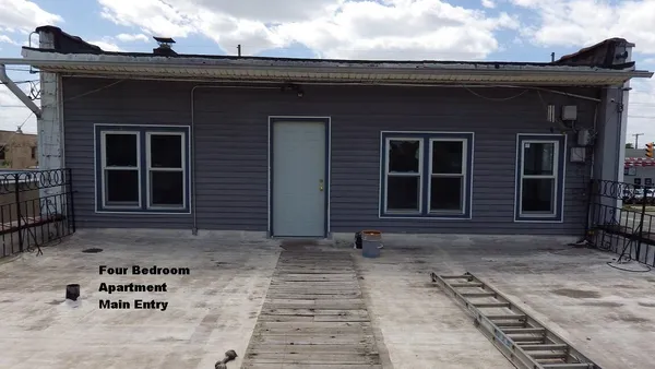 a kitchen with stainless steel appliances a stove a sink and a microwave