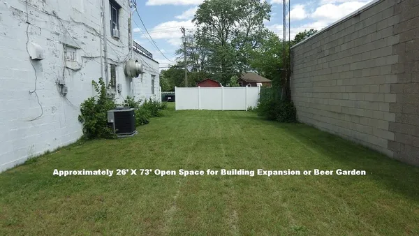 a view of a back yard of the building
