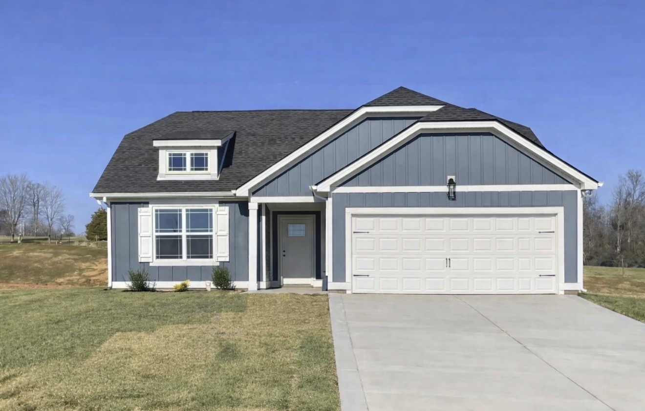 105 Morgan Lane Dickson, TN 37055 - Photo 1 of 2 a front view of a house with a yard and garage