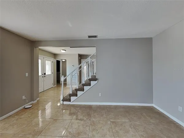 a view of a hallway with staircase