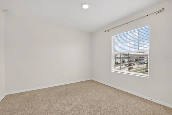 a bedroom with bed and tv