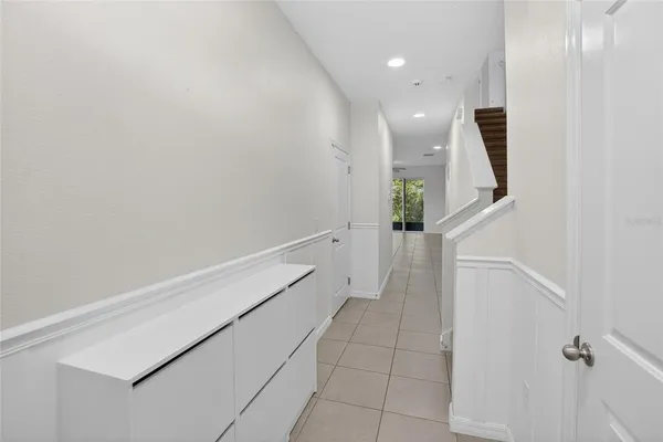 a view of a hallway with stairs