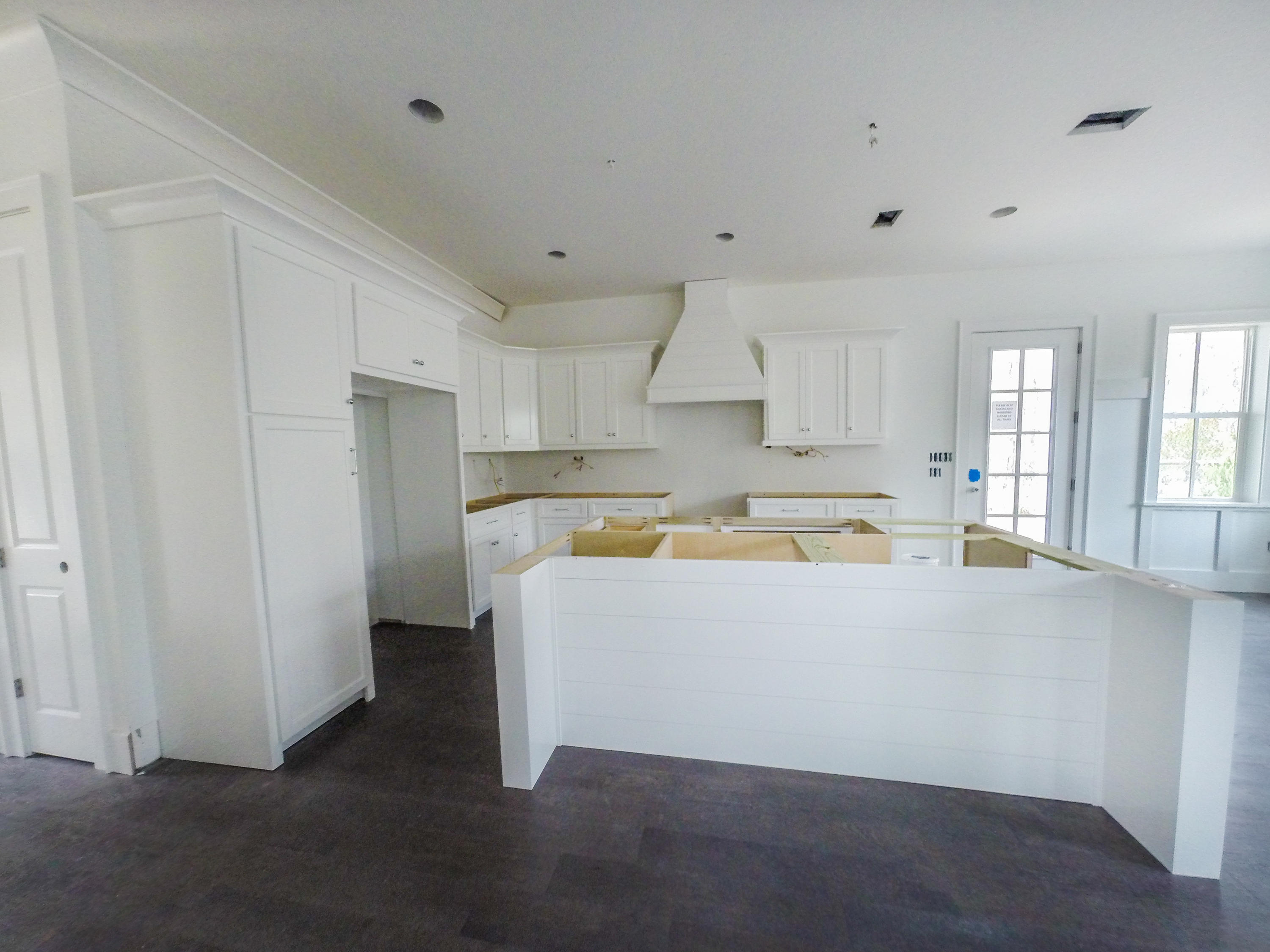 384 Matt's Way Santa Rosa Beach, FL 32459 - Photo 3 of 32 a view of kitchen with stainless steel appliances wooden floor and window