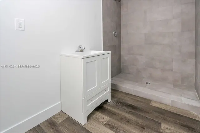a bathroom with a sink and a shower