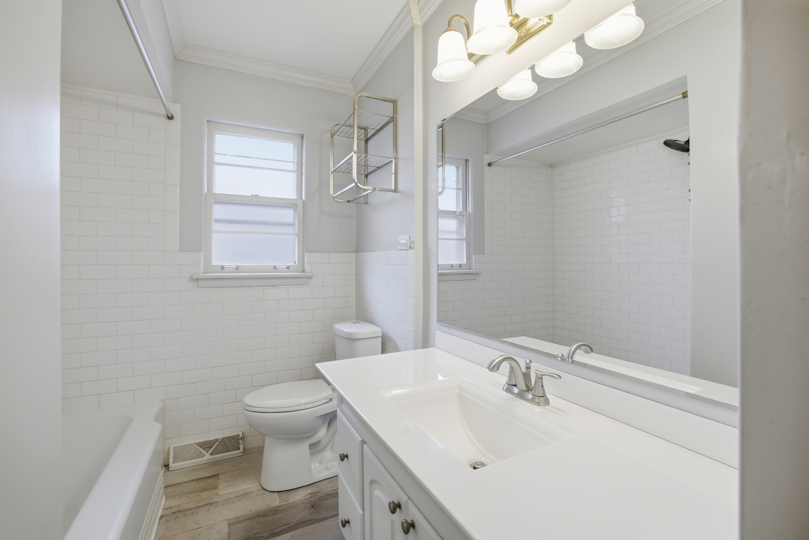 1020 Pershing Avenue Wheaton, IL 60189 - Photo 16 of 33 a bathroom with a sink a toilet and a mirror