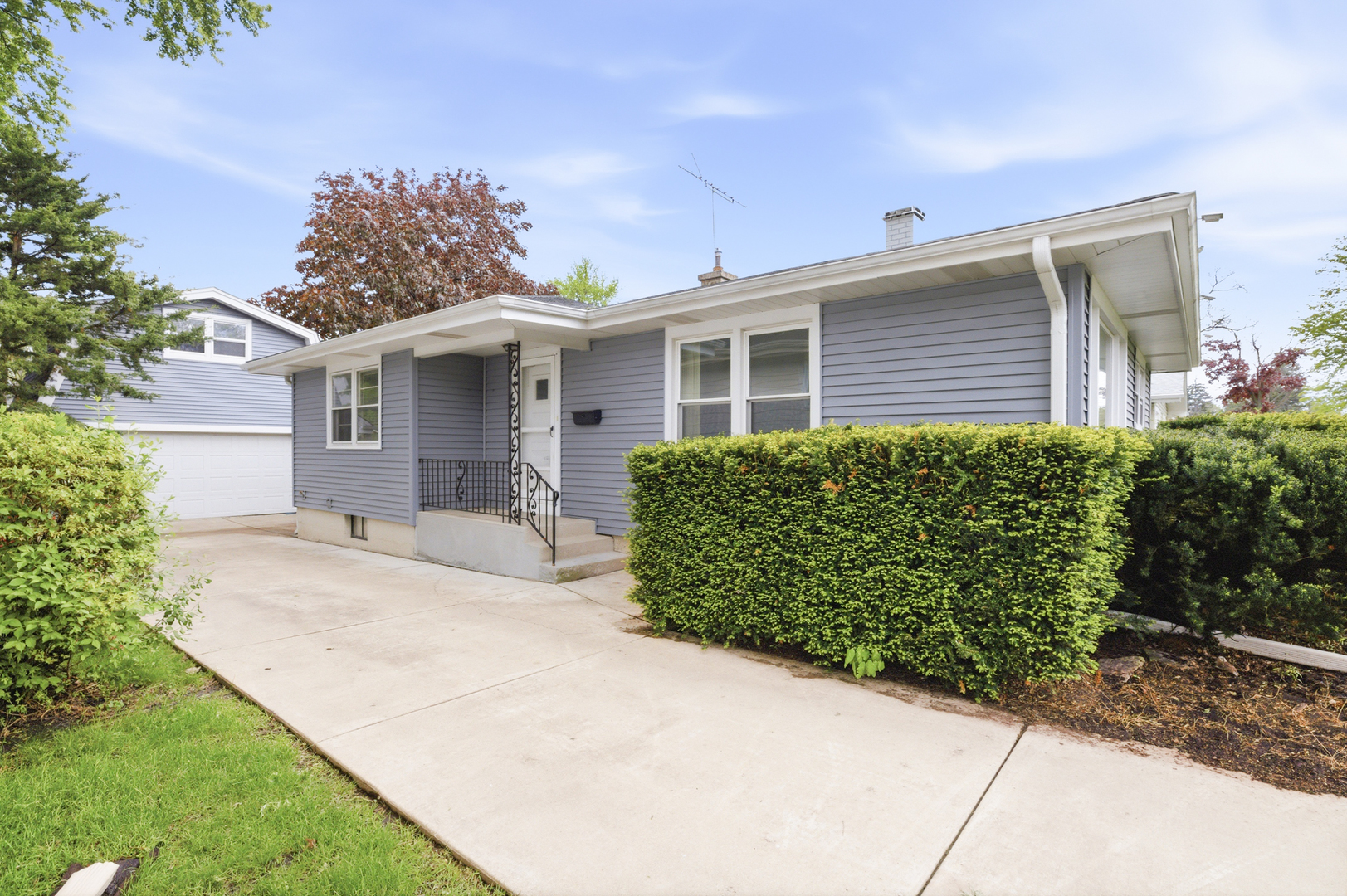 1020 Pershing Avenue Wheaton, IL 60189 - Photo 2 of 33 a front view of a house with garden