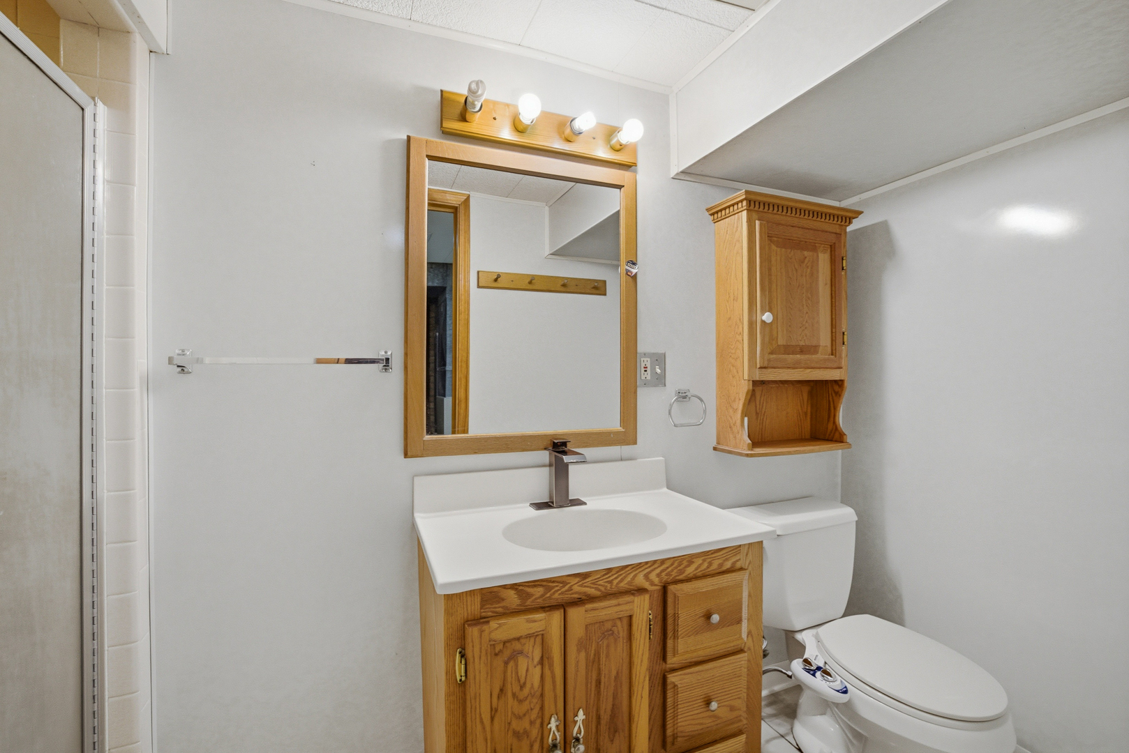 1020 Pershing Avenue Wheaton, IL 60189 - Photo 22 of 33 a bathroom with a sink a toilet and mirror