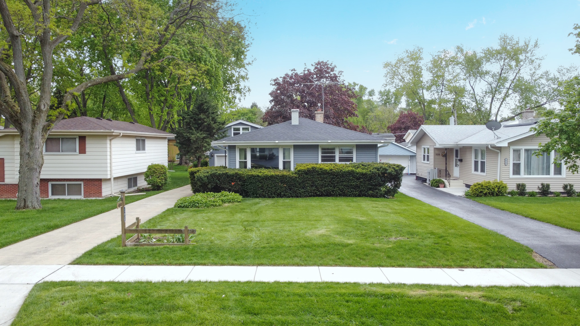 1020 Pershing Avenue Wheaton, IL 60189 - Photo 27 of 33 a front view of a house with a yard