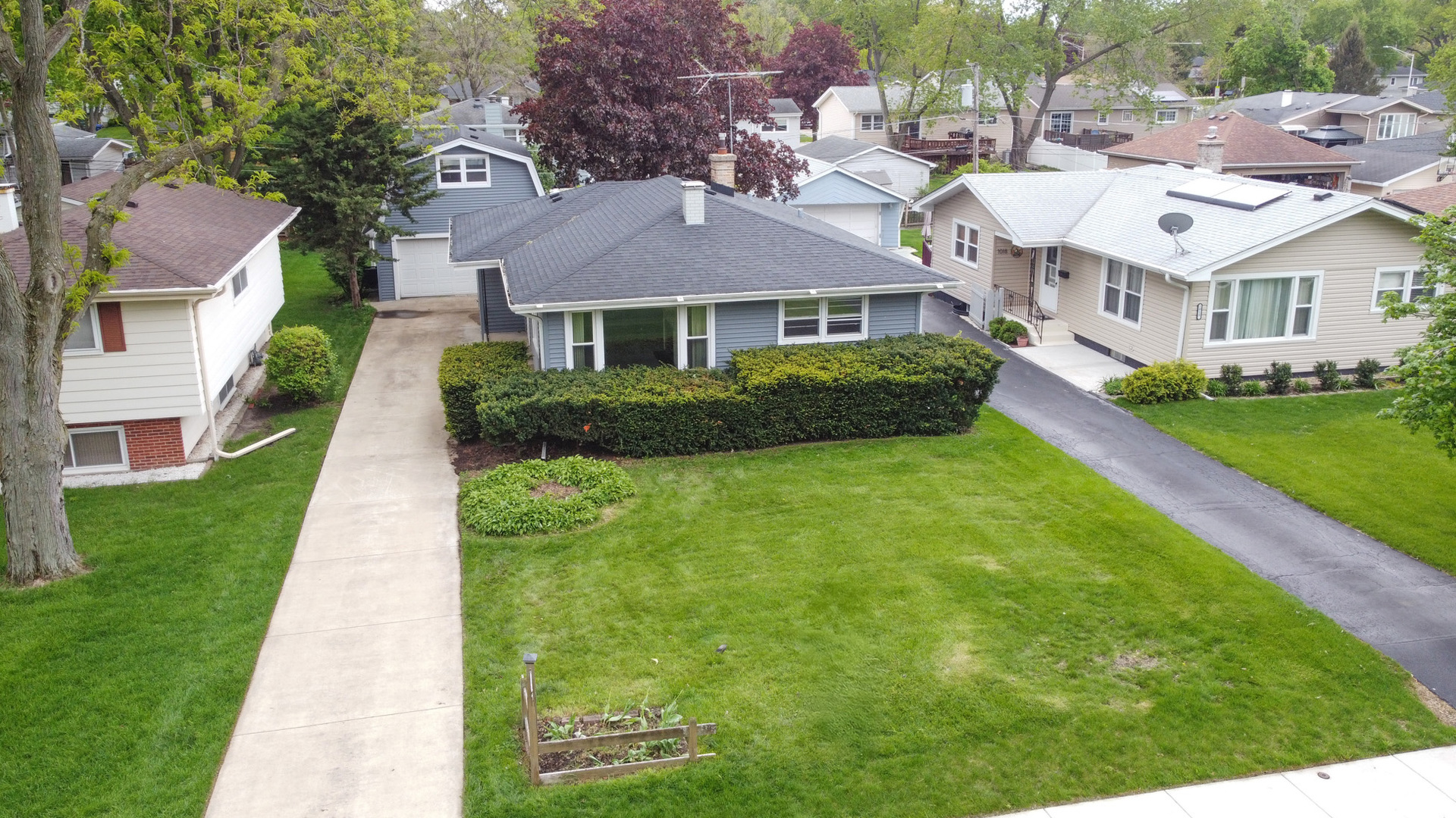 1020 Pershing Avenue Wheaton, IL 60189 - Photo 28 of 33 a front view of a house with a yard