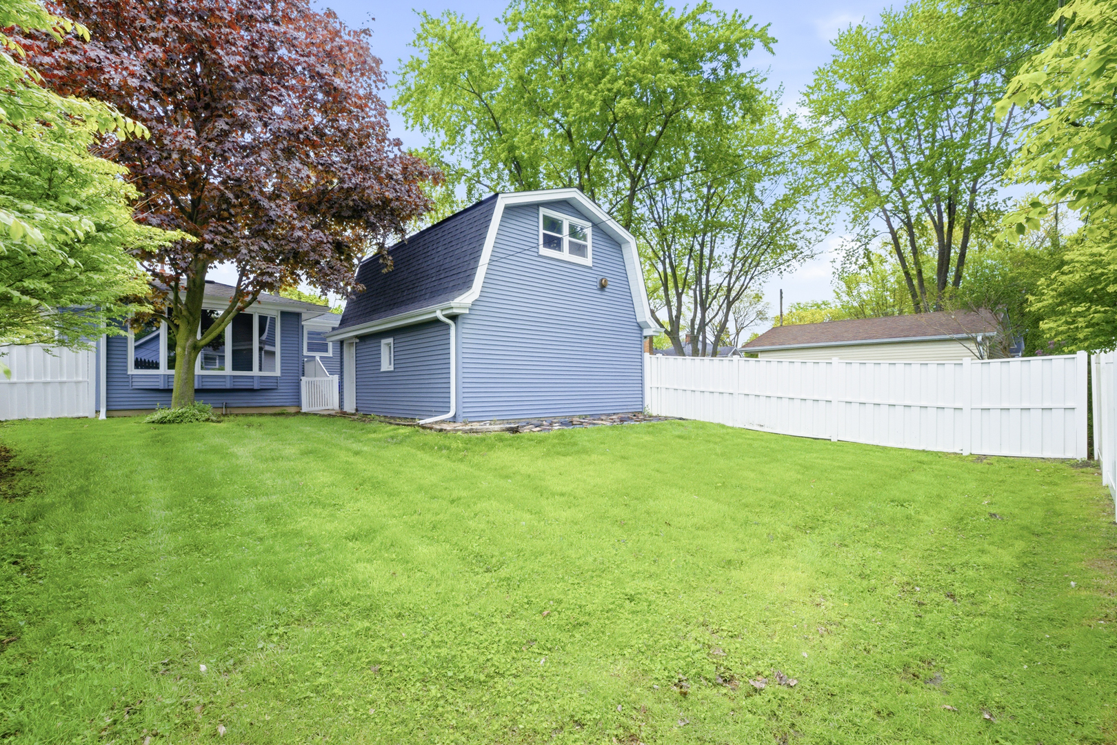1020 Pershing Avenue Wheaton, IL 60189 - Photo 3 of 33 a front view of a house with a garden