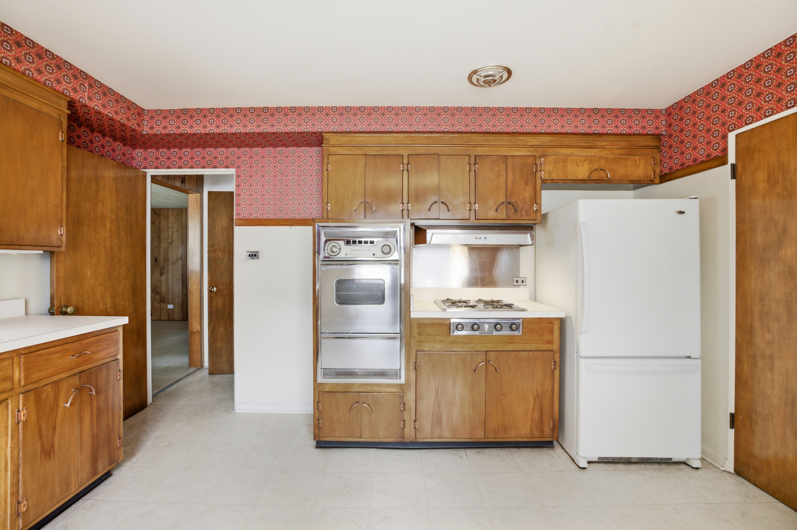 1020 Pershing Avenue Wheaton, IL 60189 - Photo 10 of 33 a kitchen with refrigerator a stove a washer and dryer
