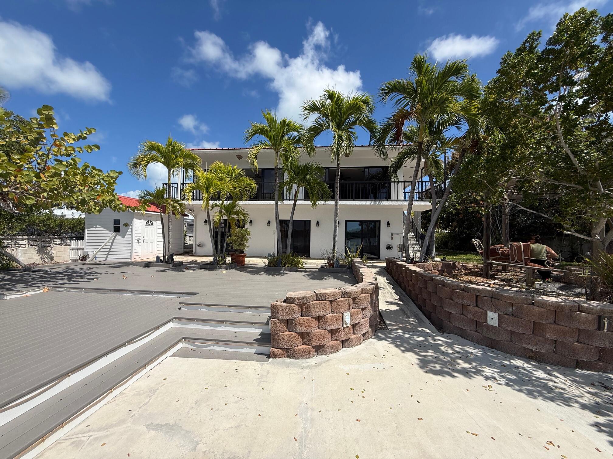 117 Key Haven Road Key West, FL 33040 - Photo 1 of 5 a view of a house with a yard and sitting area