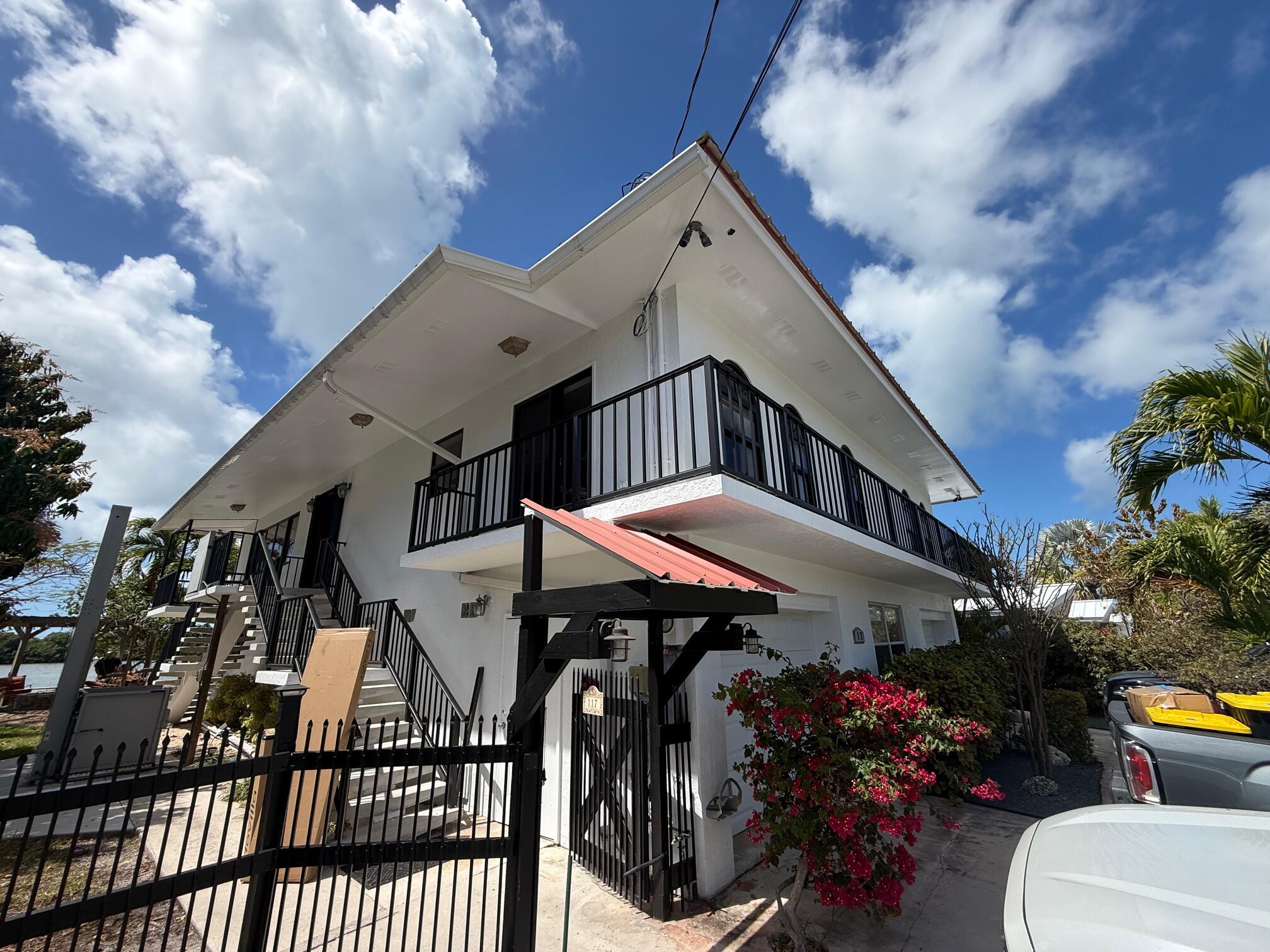 117 Key Haven Road Key West, FL 33040 - Photo 2 of 5 a view of a house with many windows