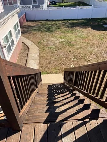 a view of a swimming pool with lawn chairs