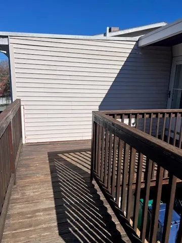 a balcony view with a wooden floor