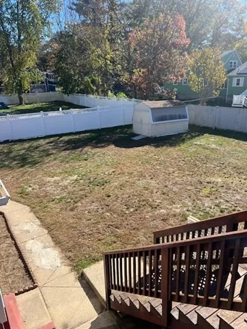 a view of a swimming pool with a chair