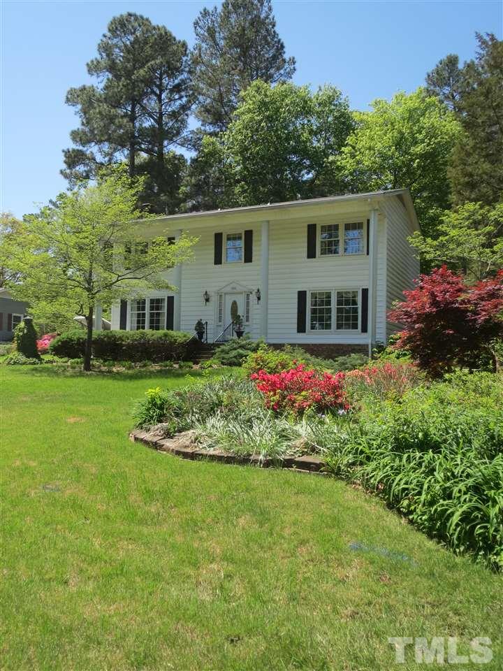 5306 Pelham Road Durham, NC 27713 - Photo 1 of 25 a front view of house with a garden and trees