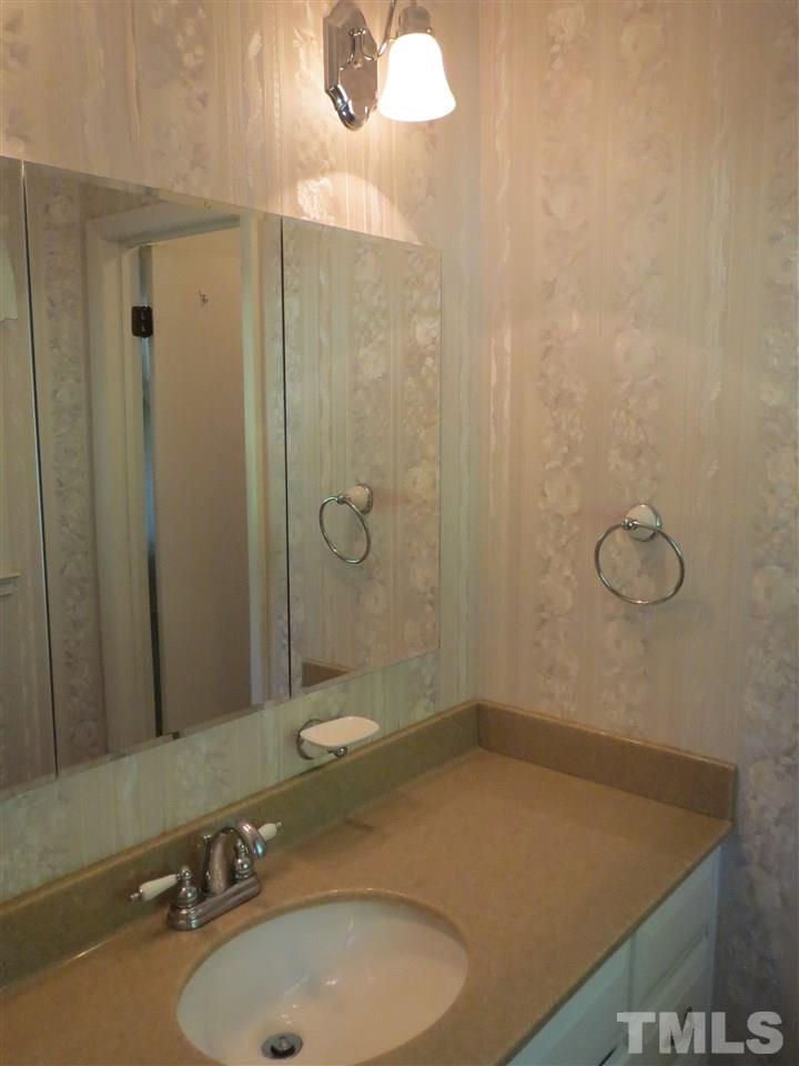 5306 Pelham Road Durham, NC 27713 - Photo 14 of 25 a bathroom with a sink a toilet and shower