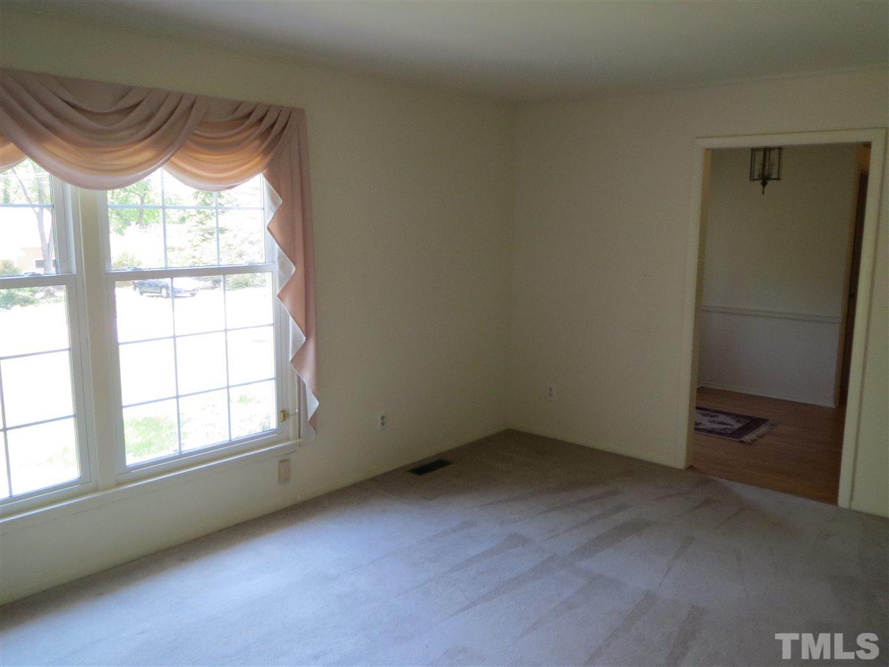 5306 Pelham Road Durham, NC 27713 - Photo 3 of 25 an empty room with a window