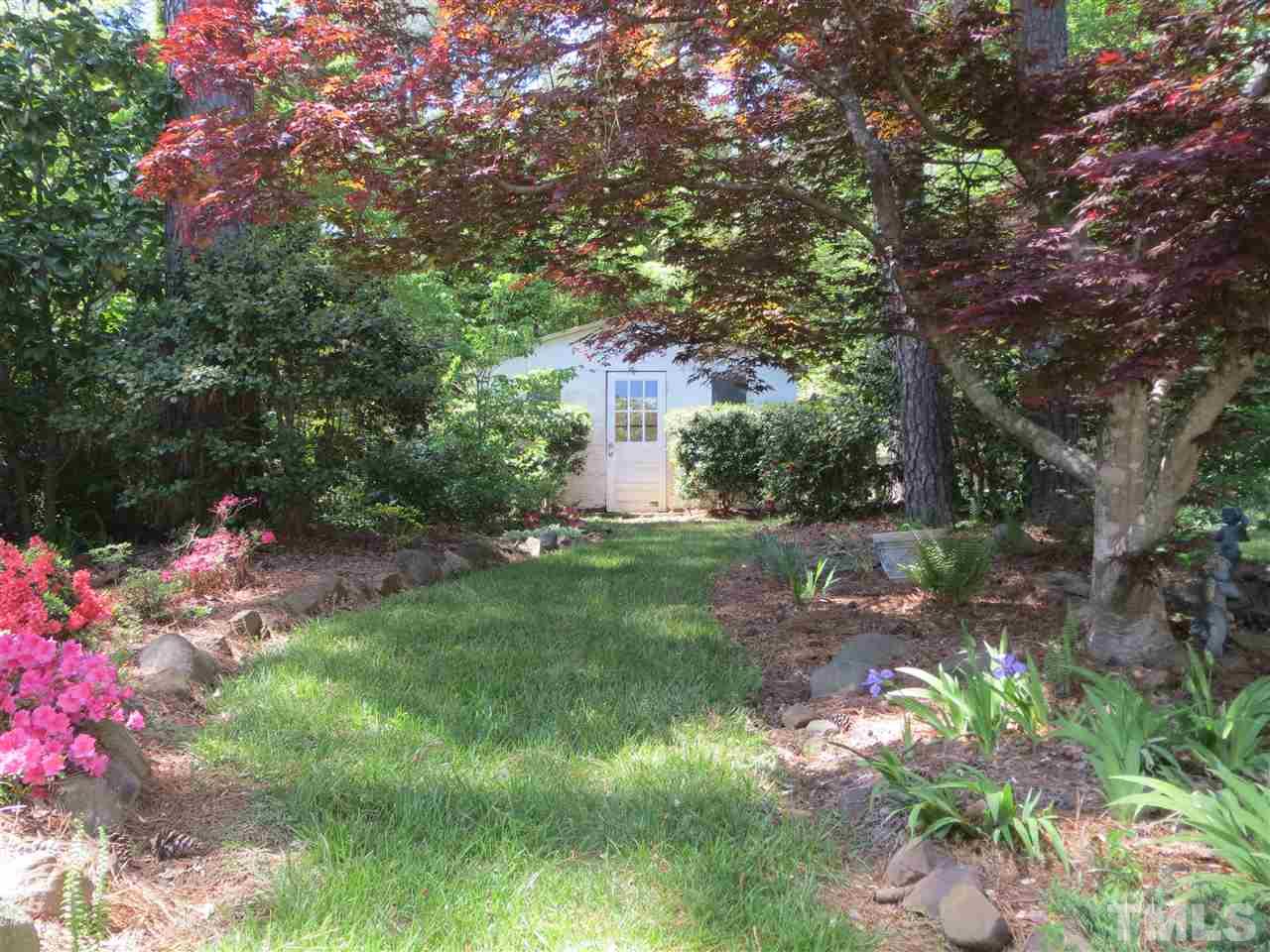 5306 Pelham Road Durham, NC 27713 - Photo 22 of 25 a front view of a house with a yard and fountain