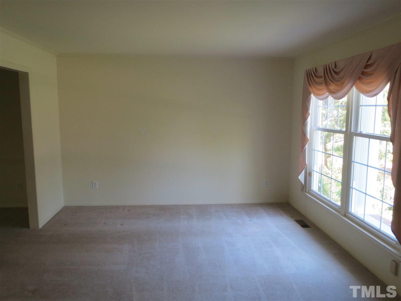 5306 Pelham Road Durham, NC 27713 - Photo 4 of 25 an empty room with a window