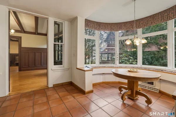 a kitchen with a refrigerator sink and cabinets