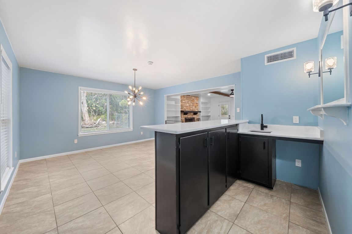 2175 Park Road New Braunfels, TX 78132 - Photo 10 of 39 formal dining with wet bar, sputnik light