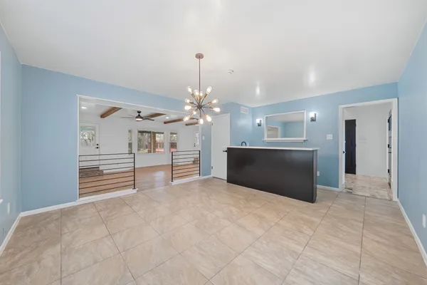 a kitchen with a sink cabinets and window