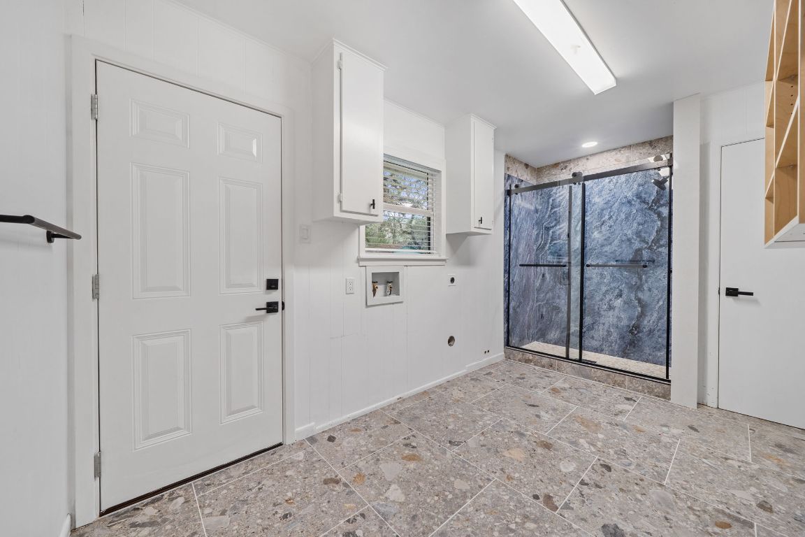 2175 Park Road New Braunfels, TX 78132 - Photo 14 of 39 Laundry room with hookup for an electric dryer, stone tile flooring, and hookup for a washing machine