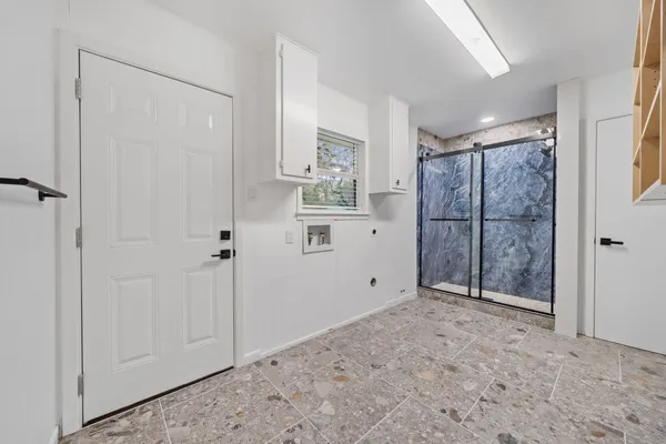 a view of an empty room with a window