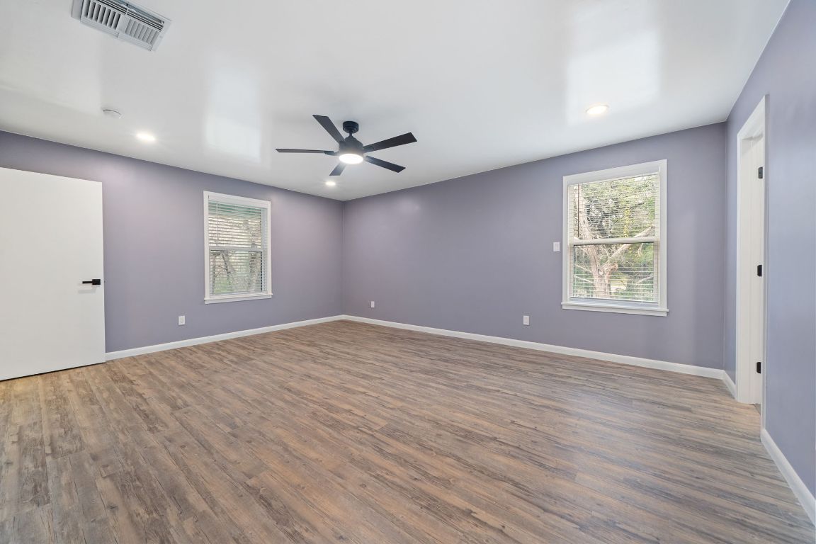 2175 Park Road New Braunfels, TX 78132 - Photo 18 of 39 Unfurnished room with dark wood-style flooring, plenty of natural light, ceiling fan, and recessed lighting
