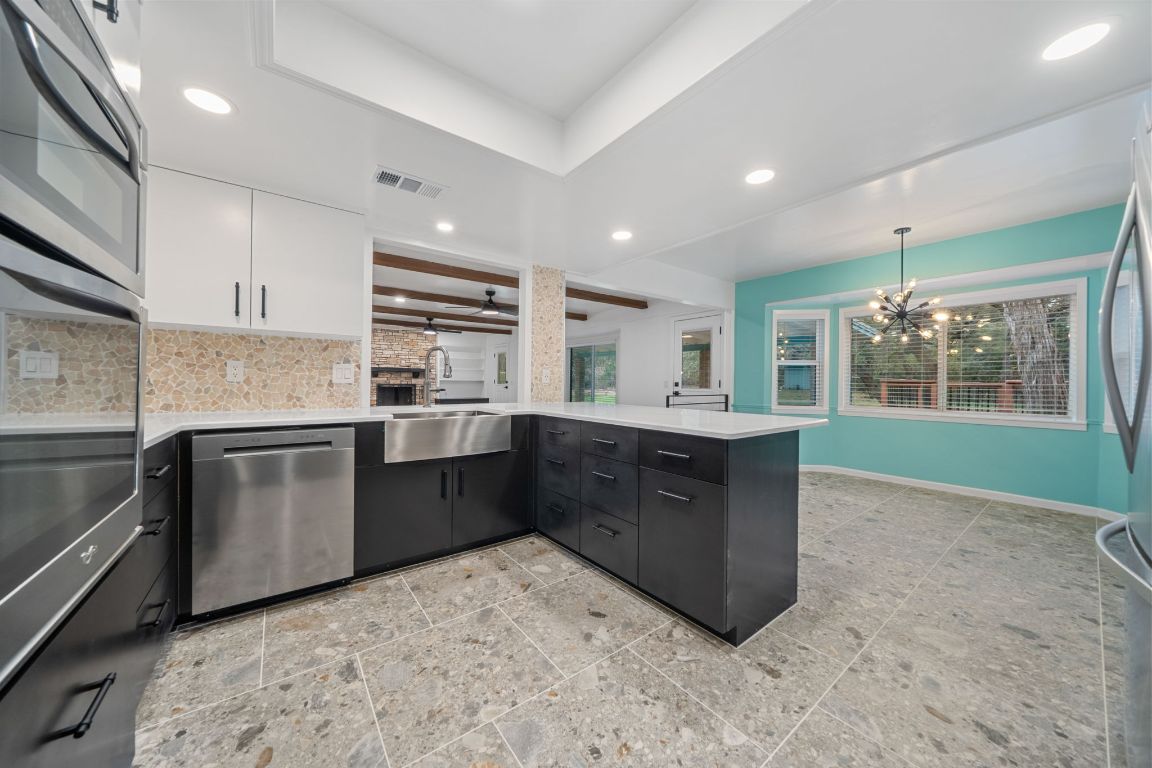 2175 Park Road New Braunfels, TX 78132 - Photo 8 of 39 Kitchen with appliances with stainless steel finishes, white cabinetry, recessed lighting, pendant lighting, and modern cabinets