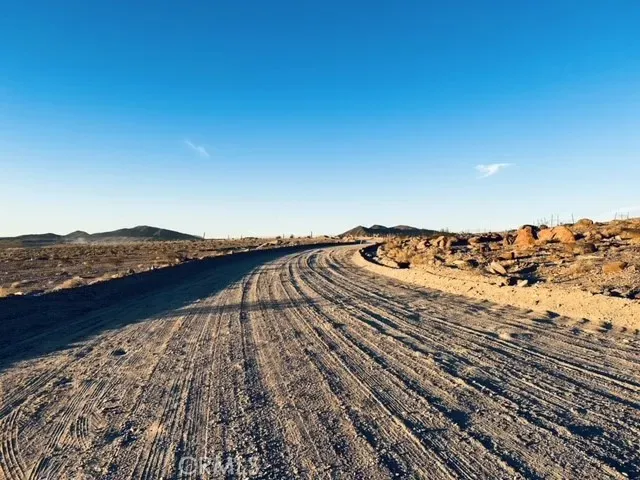 a view of a large body of water and mountain