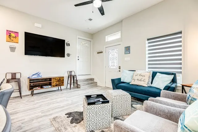 a living room with furniture and a flat screen tv