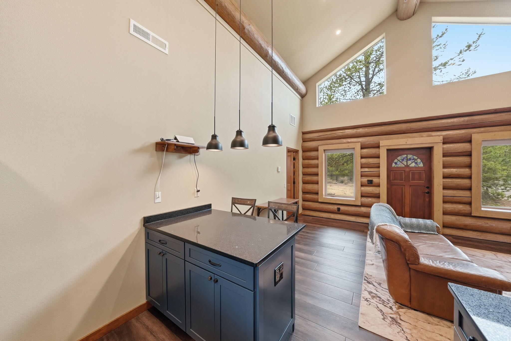 54270 Huntington Road La Pine, OR 97739 - Photo 12 of 68 a view of a kitchen with a sink and dishwasher with wooden floor