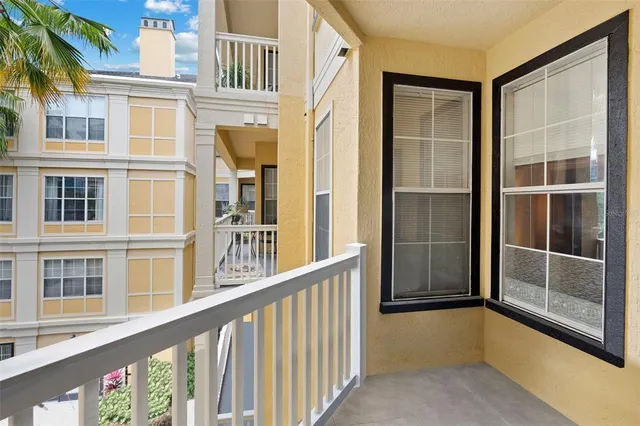 a view of balcony with a large window