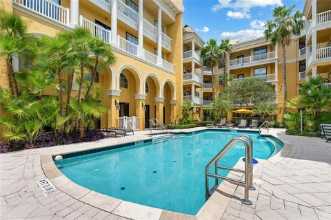 a view of a swimming pool with a lounge chairs