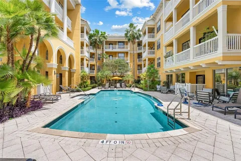 a view of a swimming pool with a lounge chairs