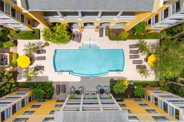 an aerial view of a house with yard swimming pool and outdoor seating