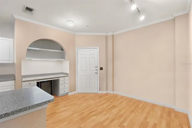 a bedroom with a bed and a fireplace