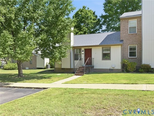 a view of a house with a yard patio and swimming pool